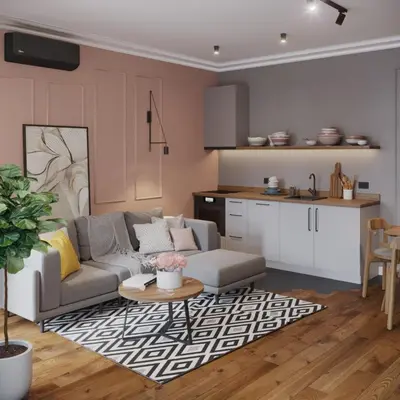 a living room with a couch and a table and a kitchen at Mibu Apartments in Belgrade