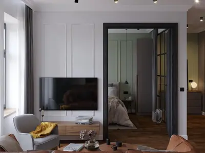 a living room with a tv and a couch and a mirror at Mibu Apartments in Belgrade