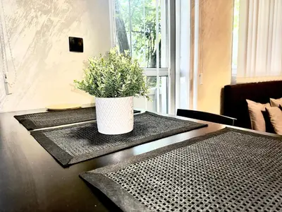 a table with a potted plant on top of it at Amazing apartman in Bele Vode in Bele Vode