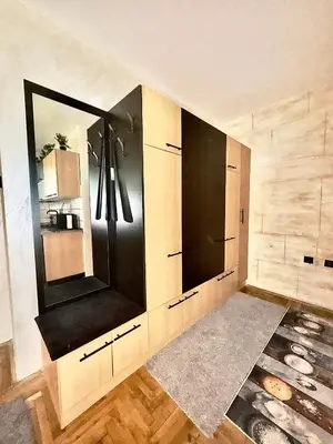 a bathroom with a large cabinet with a mirror at Amazing apartman in Bele Vode in Bele Vode