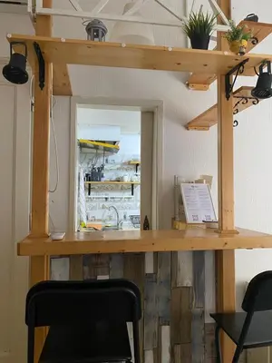 a desk in a room with two chairs at LEO Apartment in Belgrade
