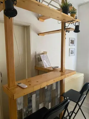 a wooden desk with a laptop on top of it at LEO Apartment in Belgrade