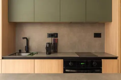 a kitchen with a sink and a stove top oven at HostGost Selected Suites - Skadarlija Artisan in Belgrade