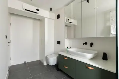 a bathroom with a sink and a toilet at HostGost Selected Suites - Skadarlija Artisan in Belgrade