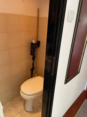 a bathroom with a white toilet in a stall at Arena 23 in Novi Beograd