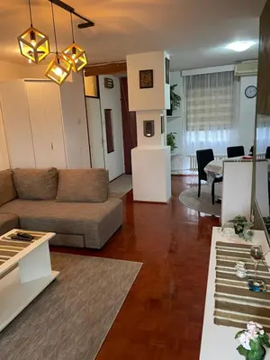 a living room with a couch and a table at Arena 23 in Novi Beograd