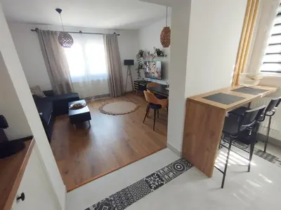 a small living room with a table and chairs at Apartman Alfa in Smederevo