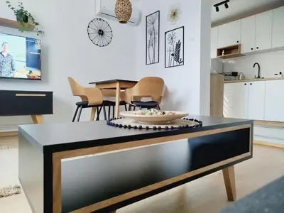 a kitchen with a table with a bowl on it at Apartman Alfa in Smederevo