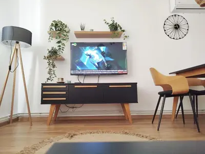 a living room with a tv on a dresser at Apartman Alfa in Smederevo