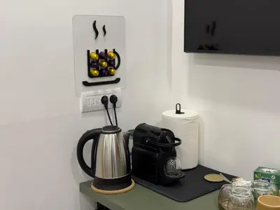 a kitchen counter with a tea kettle on a table at Maison Danube in Belgrade