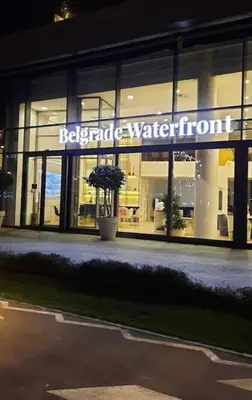 a building with a sign on the front of it at BW Residences - Belgrade Waterfront in Sajmište
