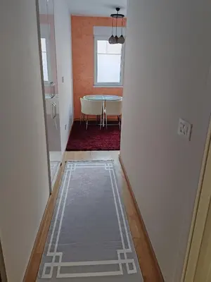 a hallway with a table in a room at Apartment Stevanovic Belgrade in Vračar (historical)