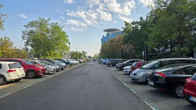 a bunch of cars parked in a parking lot at Apartment 10 in Belgrade