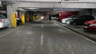 a parking garage with cars parked in it at Apartment 10 in Belgrade