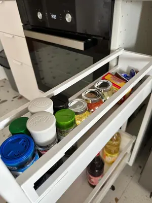 a drawer in a refrigerator filled with food at Apartment BLOK62 in Bežanija