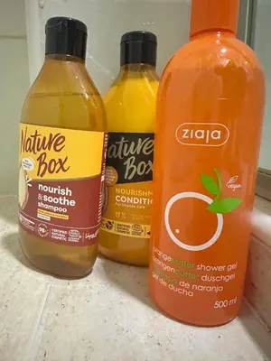 three bottles of kaya sauce sitting on a counter at Apartment BLOK62 in Bežanija