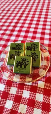 a plate with two green cards on a red and white table cloth at Mali Raj in Beška