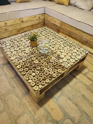 a table with a wine glass and a plant on it at Mali Raj in Beška