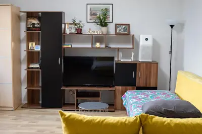 a living room with a couch and a flat screen tv at Apartment Square 59 Belgrade center in Belgrade