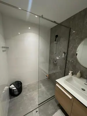 a bathroom with a shower and a sink at Belgrade Waterfront - Verde Studio in Sajmište