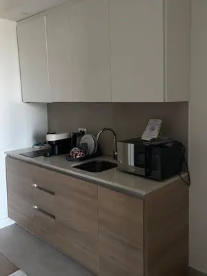 a kitchen counter with a microwave and a sink at Belgrade Waterfront - Verde Studio in Sajmište