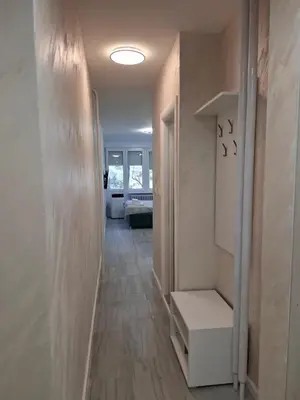 a hallway with a room with a stair case and a room with a hallway at Arena New Belgrade by Magenta in Novi Beograd