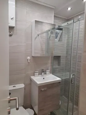 a bathroom with a toilet and a sink and a shower at Arena New Belgrade by Magenta in Novi Beograd