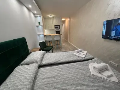 a hotel room with two beds and a flat screen tv at Arena New Belgrade by Magenta in Novi Beograd