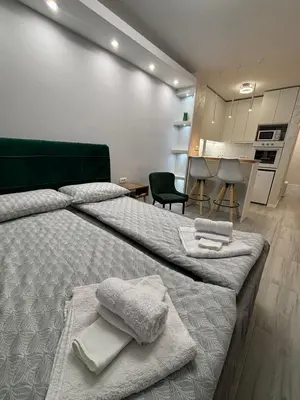 a bedroom with two beds with towels on them at Arena New Belgrade by Magenta in Novi Beograd