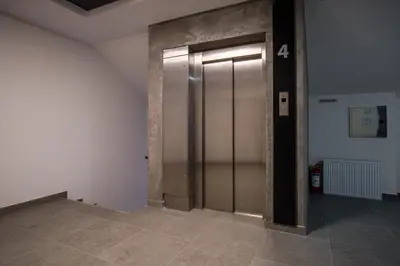 a elevator in an empty room with a door at TOP VIEW apartment 39 in Arandjelovac