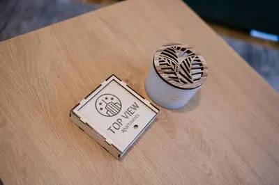 a wooden table with a cup of coffee on it at TOP VIEW apartment 39 in Arandjelovac