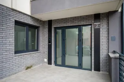 a glass door on the side of a building at TOP VIEW apartment 44 in Arandjelovac