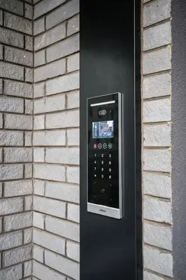 a black remote control on a brick wall at TOP VIEW apartment 44 in Arandjelovac