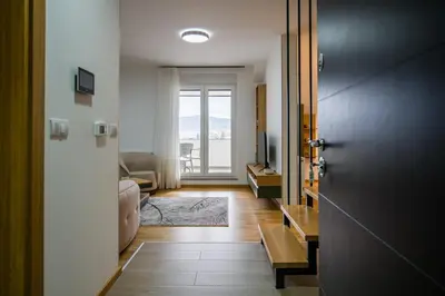 a hallway with a door leading to a living room at TOP VIEW apartment 44 in Arandjelovac