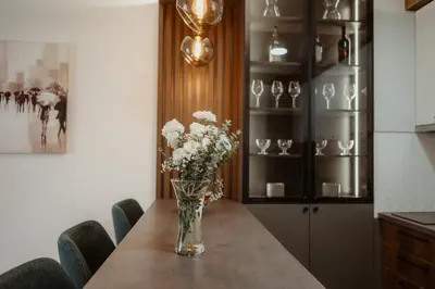 a vase of flowers sitting on top of a table at TOP VIEW apartment 47 in Arandjelovac