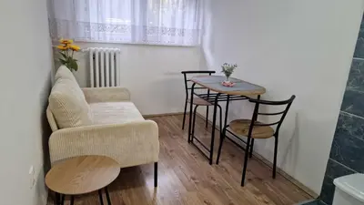 a living room with a chair and a table at Fontana in Belgrade