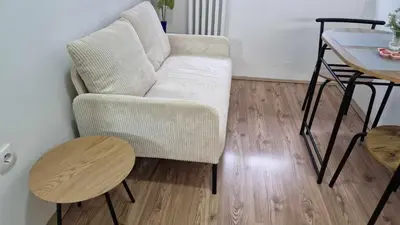 a living room with a couch and a table at Fontana in Belgrade