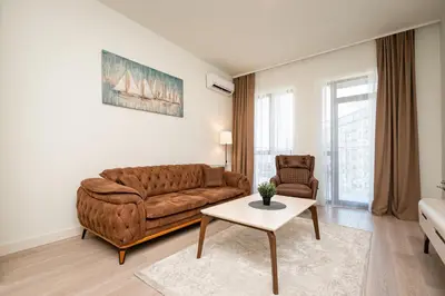 a living room with a couch and a table at Belgrade Waterfront Apartments - Libera in Belgrade