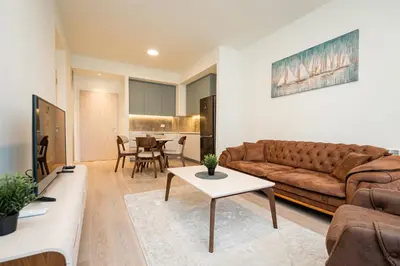 a living room with a couch and a table at Belgrade Waterfront Apartments - Libera in Belgrade