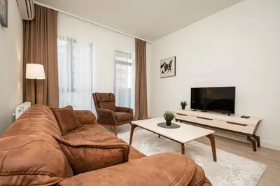 a living room with a couch and a tv at Belgrade Waterfront Apartments - Libera in Belgrade