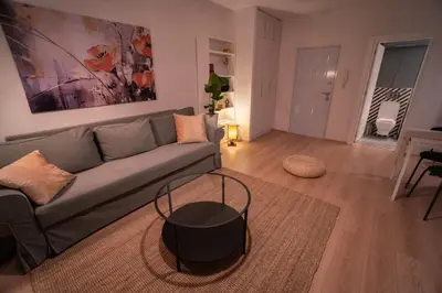 a living room with a couch and a table at Zen na dan, Belgrade in Belgrade