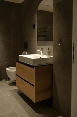 a bathroom with a sink and a toilet at Waterfront Cosy Studio Nest in Sajmište