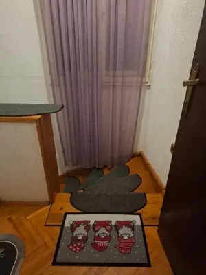a small room with some pillows on the floor at Apartman 1 in Krnjača