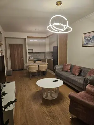 a living room with a couch and a table at BwMils Apartment in Belgrade