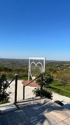 a bench with a heart sign on top of it at Hill Luxury House in Šepšin