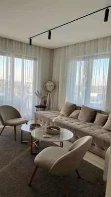 a living room with a couch and a table and chairs at Hill Luxury House in Šepšin