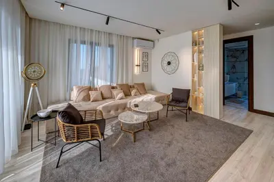 a living room with a couch and a table and chairs at Hill Luxury House in Šepšin