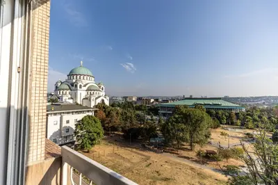 a view of a building from a balcony at Hram Vracar in Belgrade