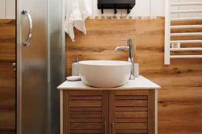 a bathroom with a bowl sink on a counter at Urban Corner 5min to Republic Square Renovated in Belgrade