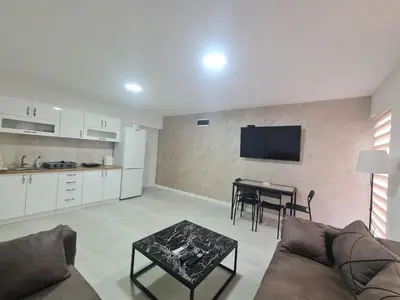 a living room with a couch and a table at Marash apartman 2 in Belgrade
